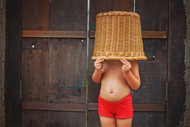 Little girl with basket on her head
