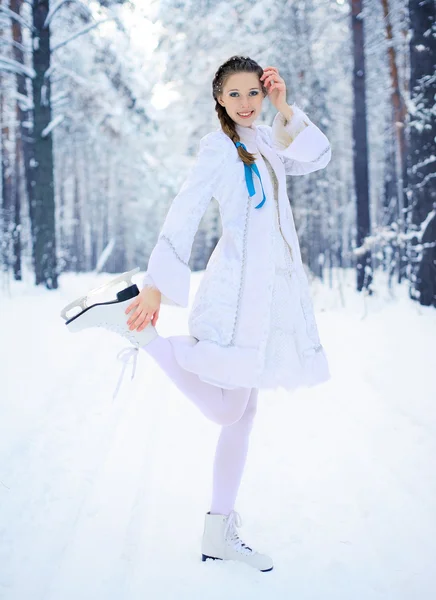 Beautiful girl in a winter forest — Stock Photo, Image