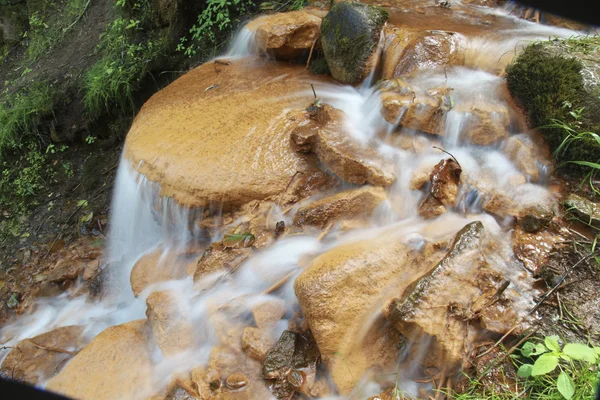 Spring water flowing over rocks — Stock Photo, Image