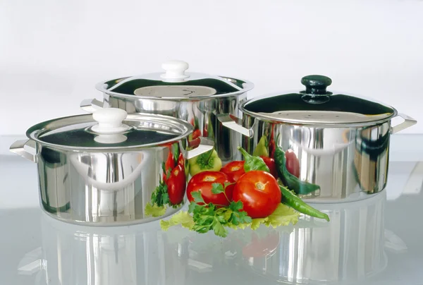 Cookware with tomatoes — Stock Photo, Image