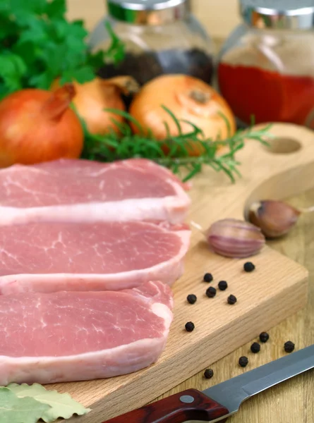 Pork on a cutting board — Stock Photo, Image