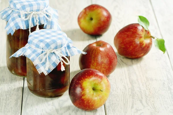 Apple jam and red apples