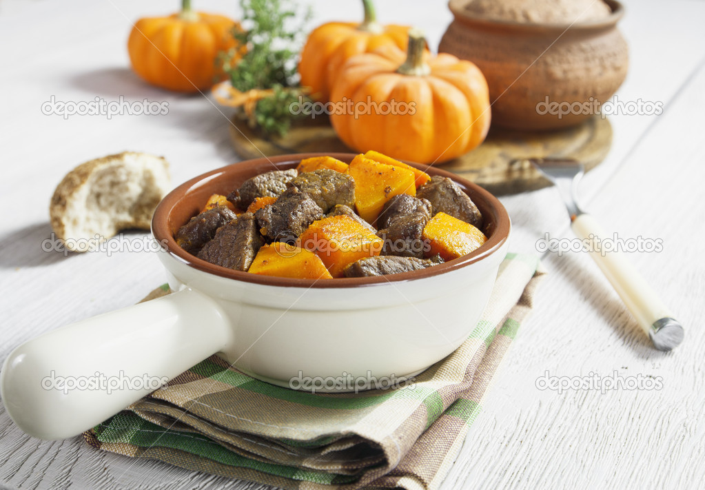 Baked pumpkin with meat. garlic and herbs