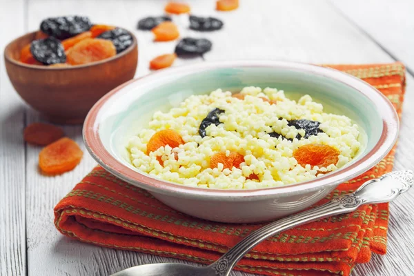 Millet porridge with dried fruit — Stock Photo, Image