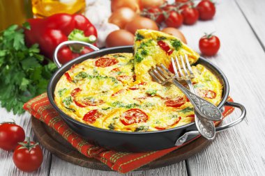 Omelet with vegetables and cheese. Frittata clipart