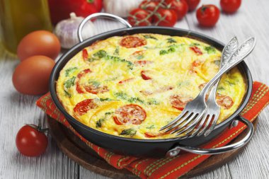 Omelet with vegetables and cheese. Frittata clipart