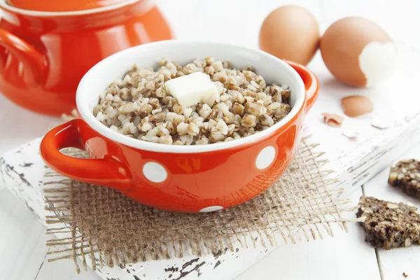 Buckwheat porridge with butter and eggs — Stock Photo, Image
