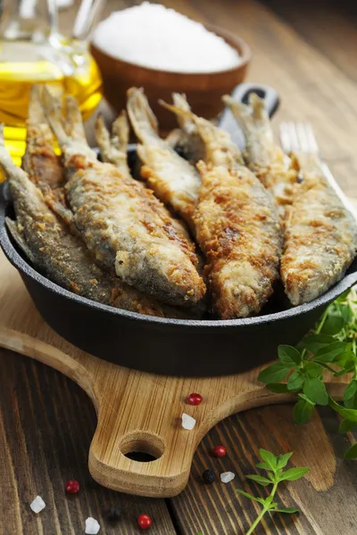 Fried fish in a frying pan — Stock Photo, Image