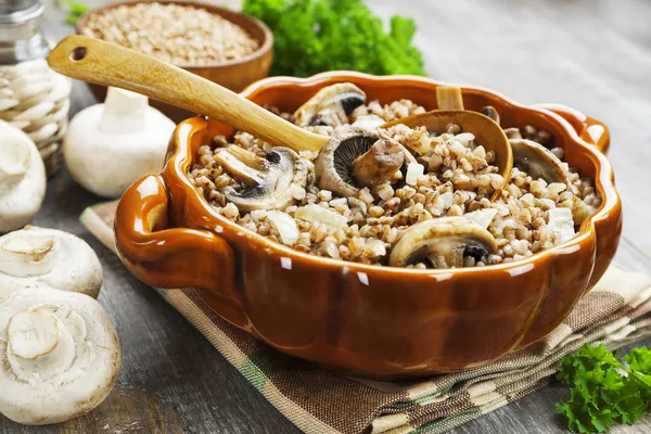 Buckwheat porridge with mushrooms — Stock Photo, Image