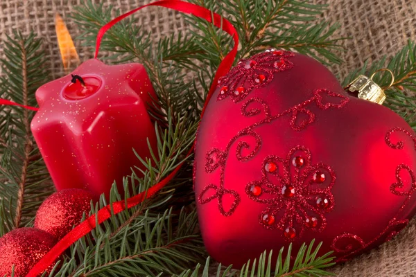 Christmas decoration with red heart and candle — Stock Photo, Image