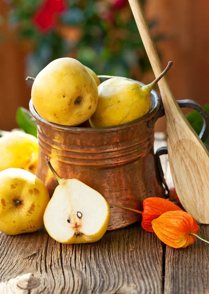 Ripe Pear in copper jug — Stock Photo, Image