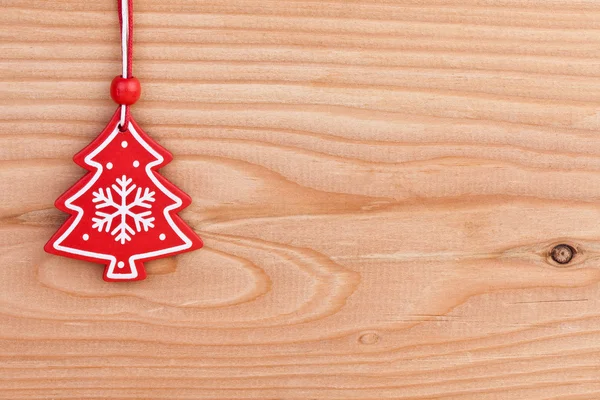 Christmas tree decoration over wooden background — Stock Photo, Image