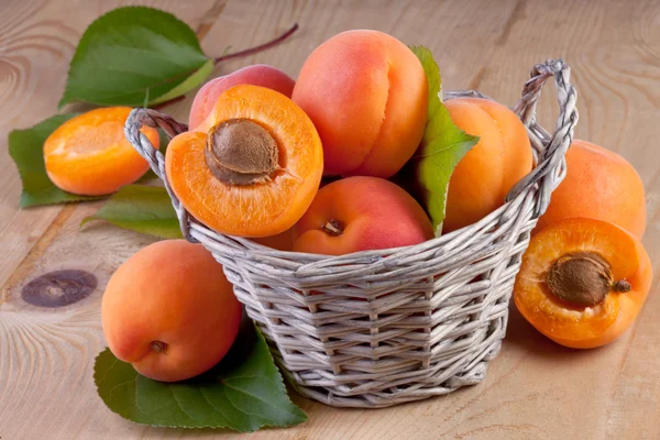 Apricots in a Basket on Wooden Background — Stock Photo, Image