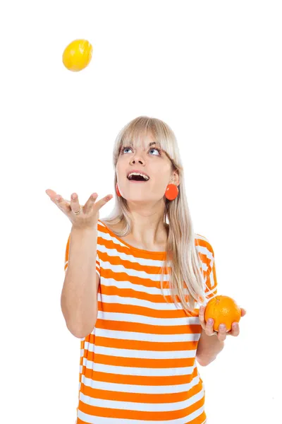 Beautiful girl choosing between fruit — Stock Photo, Image