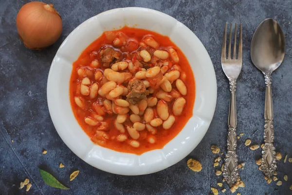 Turkish foods on a gray marble area; dried bean