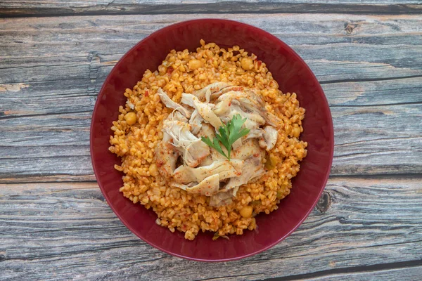 Traditional Turkish food; Chicken tandoori on bulgur pilaf (Turkish name is tandoori chicken on bulgur pilaf)