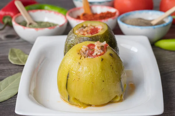 Round zucchini stuffed with vegetables and rice