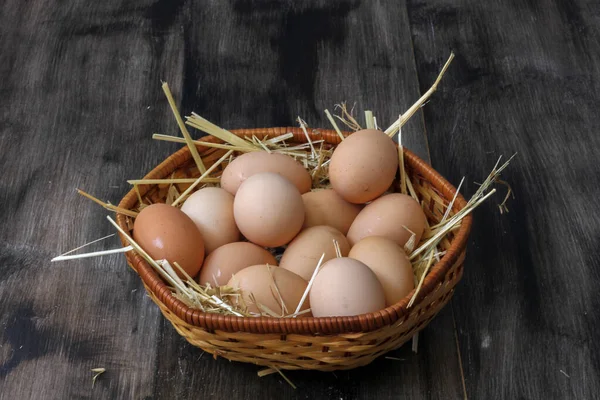 Stack Egg Straw Wooden Table Background Top View — Stockfoto