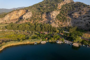 See Lycian Rock Tombs, one of the ancient architectural wonders of Turkey, carved into the cliffs facing the town of Dalyan. Mugla-Turkey