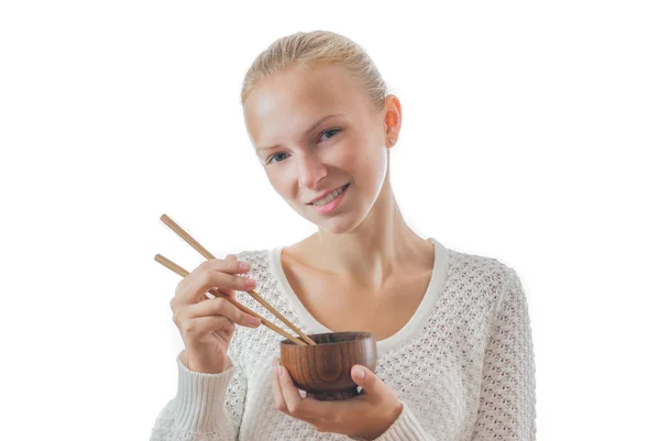 一个年轻的快乐女孩与碗和筷子 — 图库照片
