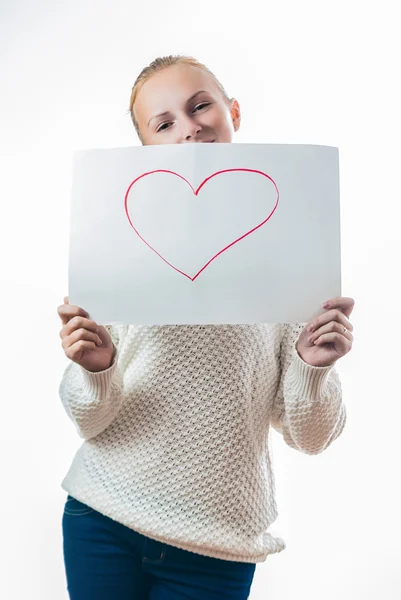 Young girl with the heart on the sheet of paper — Stock Photo, Image