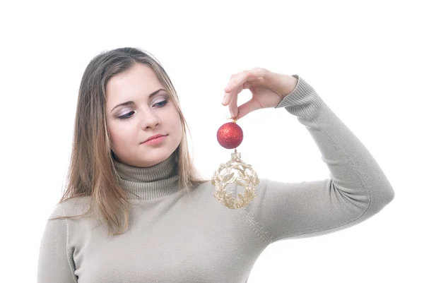 Meisje met de kerst-speelgoed in haar hand — Stockfoto