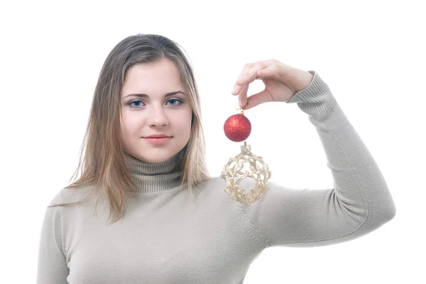 Chica con los juguetes de Navidad en la mano — Foto de Stock