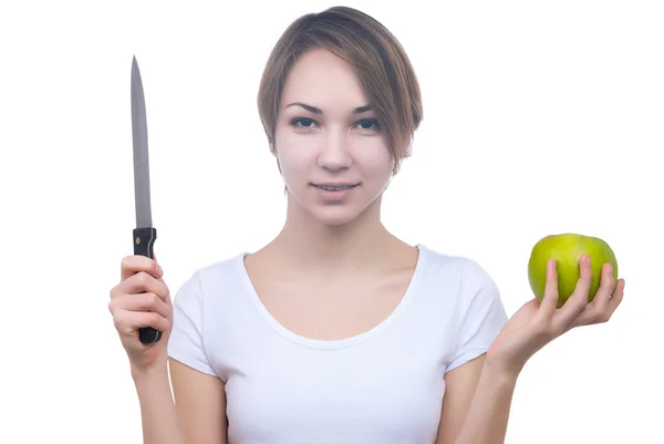 Pretty young girl with green apple and knife — Stock Photo, Image