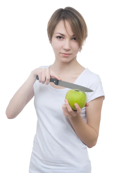 Vrij jong meisje met groene appel en mes — Stockfoto