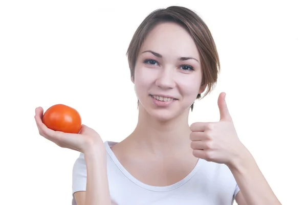 Pretty young girl holding red tomato showing ok — Stock Photo, Image