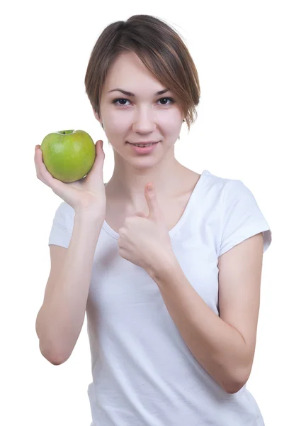 Bastante joven con manzana verde mostrando ok — Foto de Stock