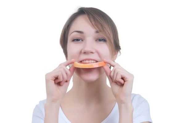 Girl biteng lobule of grapefruit — Stock Photo, Image