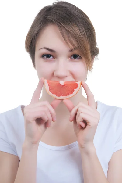 Girl with lobule of grapefruit — Stock Photo, Image