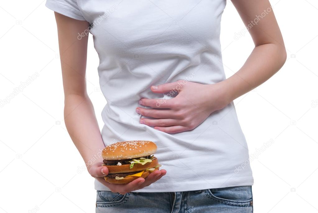 Body of girl with hamburger in the hand