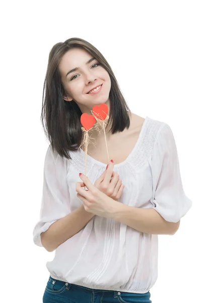 Bella mujer sosteniendo corazones sonriendo — Foto de Stock