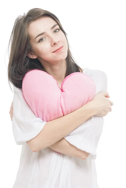 Mädchen mit valentinrosa Kissen Herz — Stockfoto