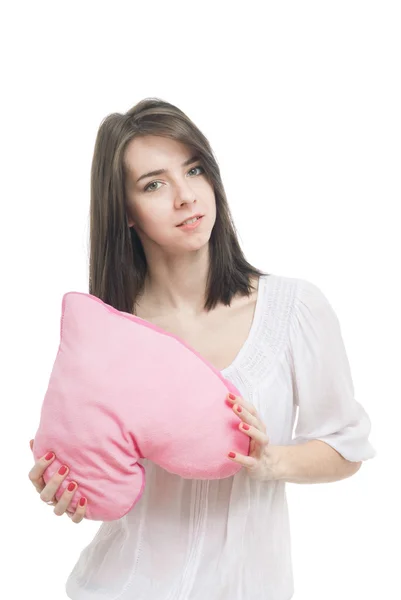 Girl with valentine pink pillow heart — Stock Photo, Image