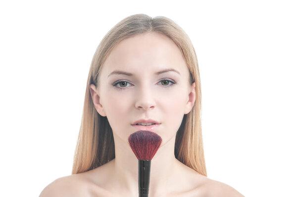 Beauty photo of girl with makeup brush.