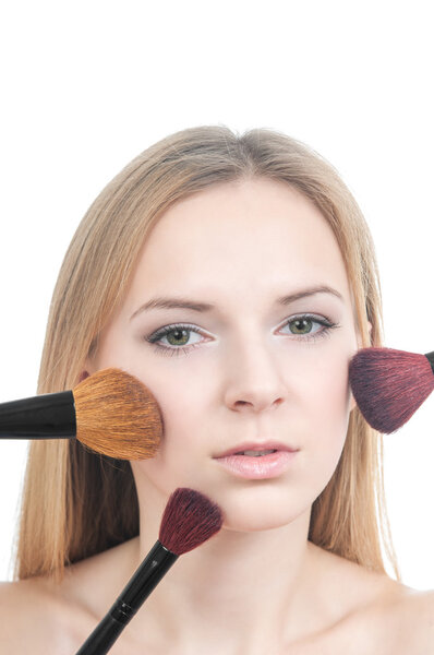 Makeup girl with blusher brushes
