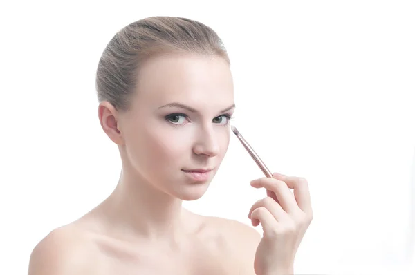 Girl with eyelid brush, isolated on white — Stock Photo, Image