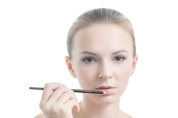 Girl with lipstick brush, isolated on white — Stock Photo, Image