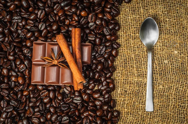 Spices and chocolaete on coffe beans — Stock Photo, Image