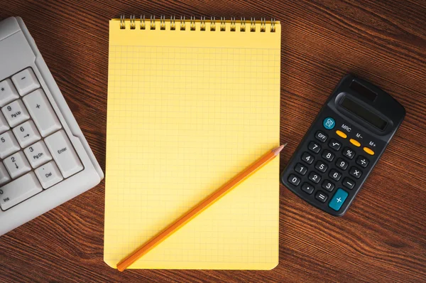 Shopping list with calculator and keyboard — Stock Photo, Image