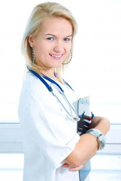 Happy nurse hands a folder — Stock Photo, Image