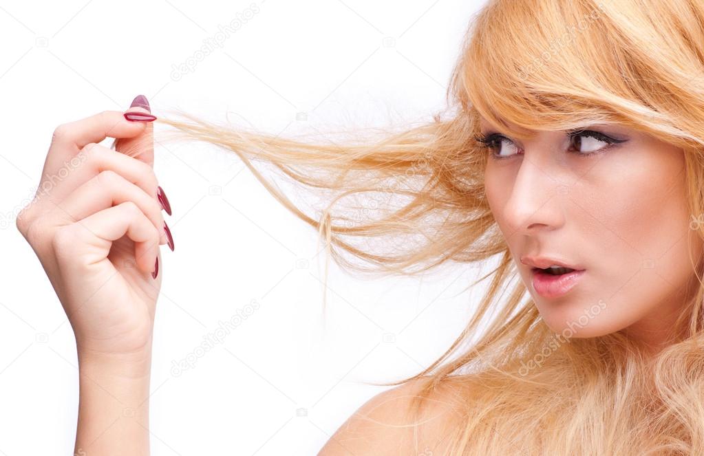 Beautiful blonde touching her hair