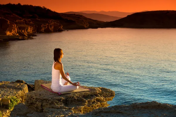 Woman in a yoga position — Stock Photo, Image