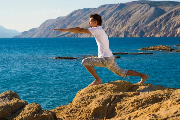 Man in a yoga position — Stock Photo, Image