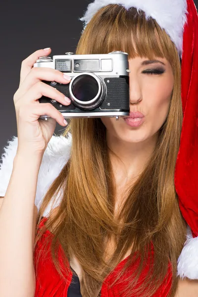 Portrait of a santa woman with a old camera — Stock Photo, Image