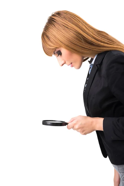 Businesswoman with magnifying glass — Stock Photo, Image