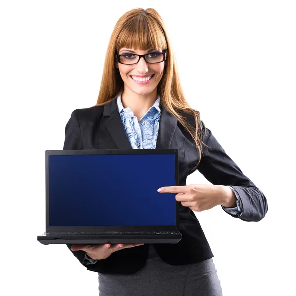 Business woman presenting a laptop — Stock Photo, Image